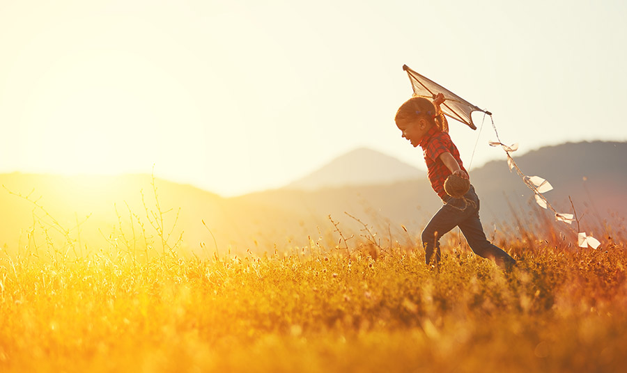 Kid flying a kite